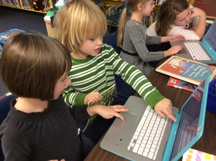 Children working on a ChromeBook