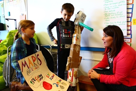 Amy Minor, Superintendent, with students